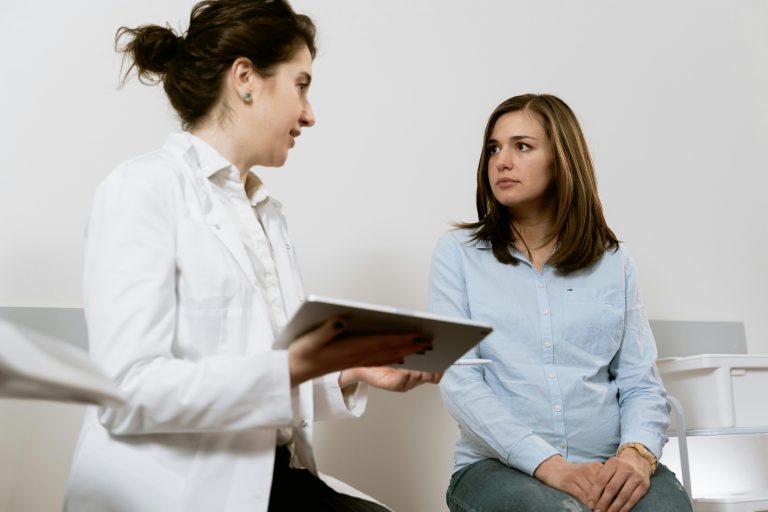Medical professional reviewing workers' compensation case files, representing AME and QME evaluations in California.